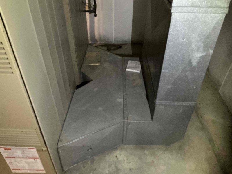 Responded to no cooling complaint on second floor air conditioning system. Evaluated 27-year-old HVAC system including furnace/air handler unit, ductwork, and associated components located in mechanical room. Documented existing equipment condition with photos showing aged system with worn flexible ductwork and standard residential installation configuration. Provided estimate for complete system replacement due to age and inefficiency of current equipment.