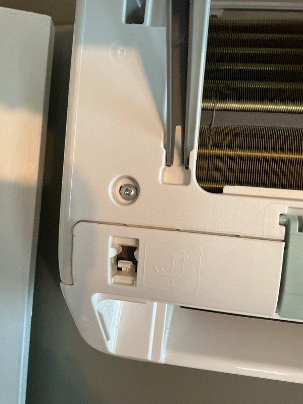 Responded to service call for mini split system in bedroom. Inspected wall-mounted indoor unit and identified malfunctioning side louver that was not closing properly. Examined louver mechanism and heat exchanger components for obstruction or mechanical failure. Documented unit condition with photos showing internal components and control panel features. Provided guidance on obtaining replacement remote control for system operation. Reviewed warranty coverage details and explained what components and services are included under the existing warranty terms.