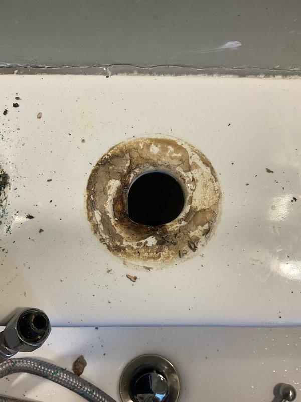 Installed a two-handle chrome widespread lavatory faucet with pop-up drain assembly on bathroom sink. Ordered and supplied necessary extensions and volume control components to complete the installation and ensure proper water flow and drainage function.