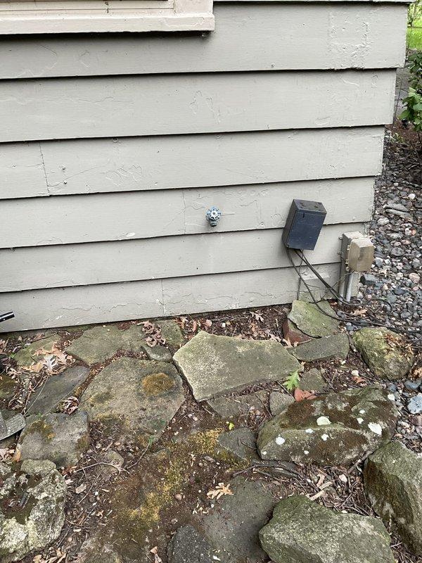 Responded to service call for plugged outdoor spigot and reduced water flow in front bathroom faucet. Upon inspection, diagnosed blockage in exterior hose bib affecting water pressure throughout connected plumbing lines. Cleared obstruction from outdoor spigot assembly and verified proper water flow restoration to both the exterior fixture and interior bathroom faucet. Documented existing conditions of exterior plumbing access point and interior plumbing connections with photographic evidence for service records.