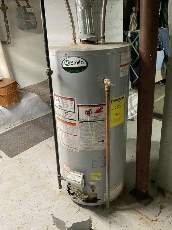 Responded to service call for leaking 40-gallon gas water heater requiring replacement. Upon inspection, confirmed existing AO Smith unit was actively leaking and beyond economical repair. Removed and disposed of failed water heater, installed new 40-gallon gas-fired water heater with proper venting and connections, verified all safety valves and pressure relief components functioning correctly, and tested unit for proper operation before completing service.