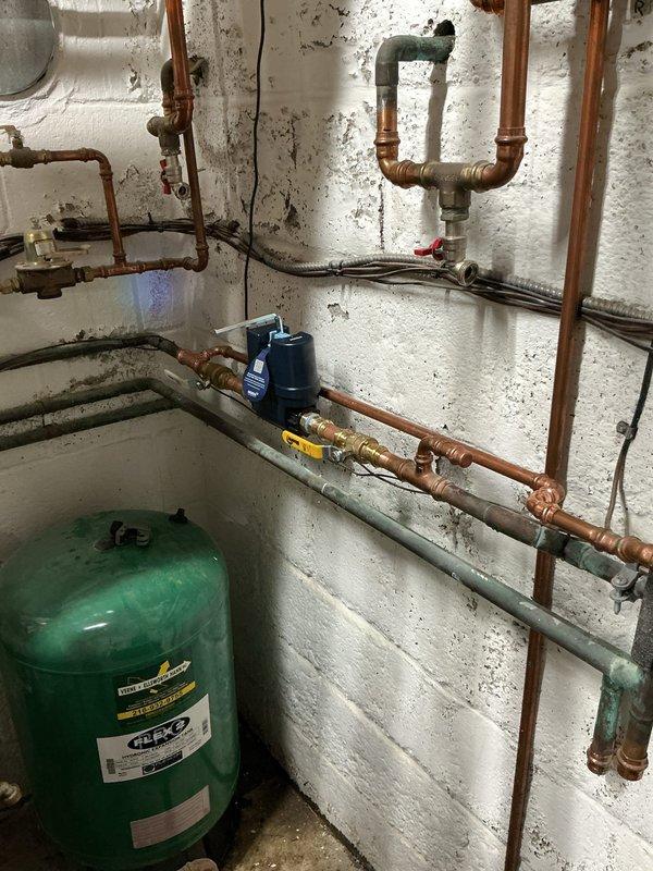 Responded to emergency call for water shutoff issue affecting Delta plumbing system. Upon arrival, located and isolated water supply to prevent further damage to property. Inspected basement utility area plumbing infrastructure including copper supply lines, pressure tank, circulator pump, and associated valves. Successfully shut off water supply using existing shutoff valves in the system. Verified all connections were secure and system was properly isolated. Completed emergency service to stabilize situation and prevent water damage.