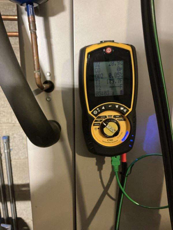 Completed comprehensive furnace tune-up and performance evaluation. Performed combustion analysis using digital diagnostic equipment, recording oxygen levels at 20.7%, CO2 at 0.052%, supply temperature at 139.7°F, and return temperature at 85.4°F, confirming proper combustion efficiency and heat exchanger operation. Inspected blower assembly and fan motor components, verifying blade condition and airflow distribution throughout the system.