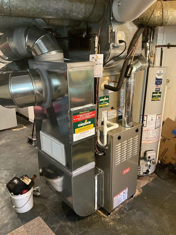 Completed full HVAC system replacement at residential property. Removed existing furnace, evaporator coil, and air conditioning condenser unit. Installed new Bryant furnace in basement mechanical room with proper clearances and venting. Mounted new evaporator coil on top of furnace unit and connected refrigerant lines. Installed new Bryant outdoor condenser unit on rubber isolation pad against exterior brick foundation. Ran and secured copper refrigerant linesets between indoor and outdoor equipment. Tied back existing return air ductwork to new furnace, ensuring proper airflow and system integration. Installed metallic supply ductwork from furnace plenum. Verified all electrical connections, tested system operation, and confirmed heating and cooling functions performing to manufacturer specifications.
