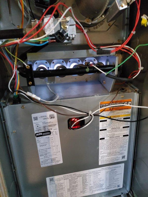 Responded to service call for pilot light ignition on gas furnace and water heater. Successfully relit pilot lights on both the HVAC furnace system and the Bradford White 40,000 BTU/HR natural gas water heater, verified proper ignition and flame characteristics, and confirmed both units returned to normal operation.