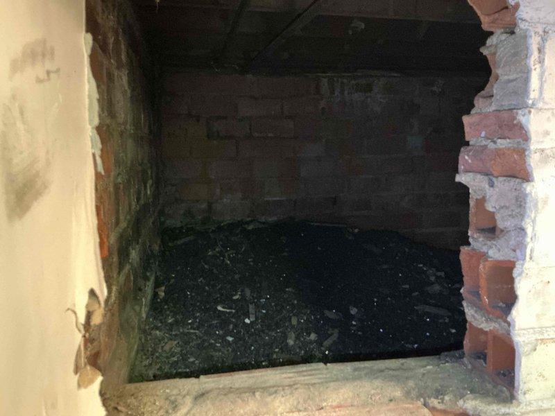 Conducted follow-up site assessment for HVAC system replacement in residential property. Documented existing interior conditions and evaluated installation access points, including assessment of fireplace opening that showed evidence of deterioration, moisture damage, and accumulated debris requiring consideration for equipment placement and ventilation routing.