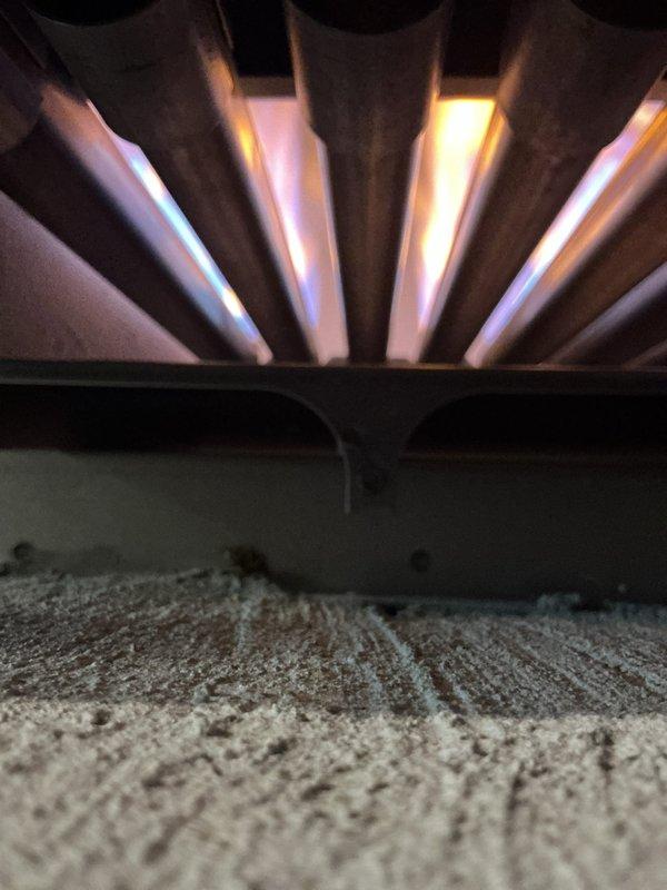 Performed comprehensive tune-up and routine maintenance on 10-year-old steam boiler and 2-year-old water heater located in basement. Inspected all piping connections, brass fittings, and ball valves for leaks and proper operation. Verified burner assembly operation with visual flame inspection showing proper combustion with characteristic blue flames across all burner sections. Tested safety controls, examined heat exchanger components, and confirmed all electrical connections were secure. System operating within normal parameters upon completion.