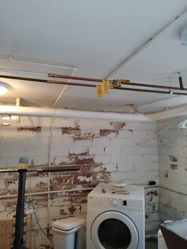 Performed extensive plumbing stack repair requiring access from basement through third floor. Opened walls and ceilings to expose main stack work and branch drains serving multiple fixtures including sinks and tubs. Utilized existing access panels behind tubs where available and created additional access points in ceilings and walls as needed to reach all affected drain lines. Coordinated with customer regarding necessary demolition scope prior to commencing work to ensure full understanding of access requirements for proper repair completion.