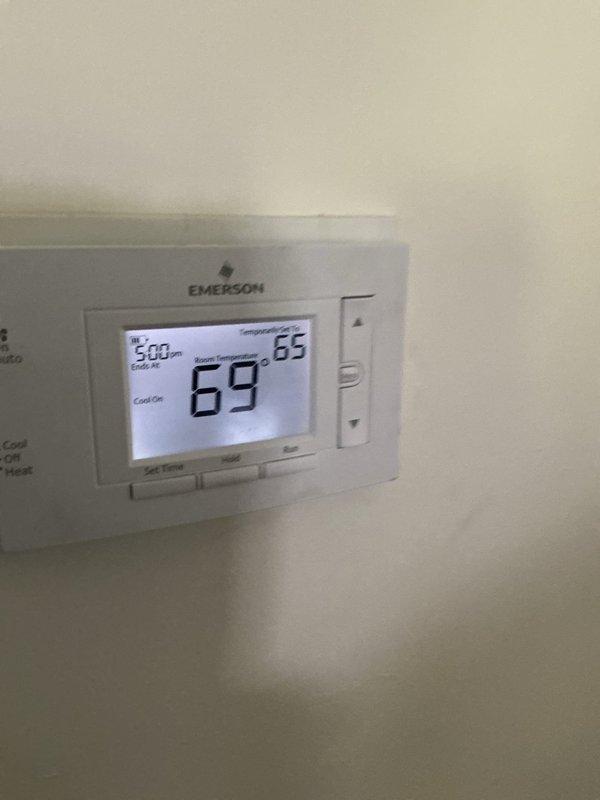 Completed routine air conditioning tune-up on residential HVAC system. Performed comprehensive inspection of furnace/air handler unit and associated components, verified thermostat operation showing proper temperature control at 69°F setpoint, and confirmed system is operating within normal parameters with no deficiencies noted.