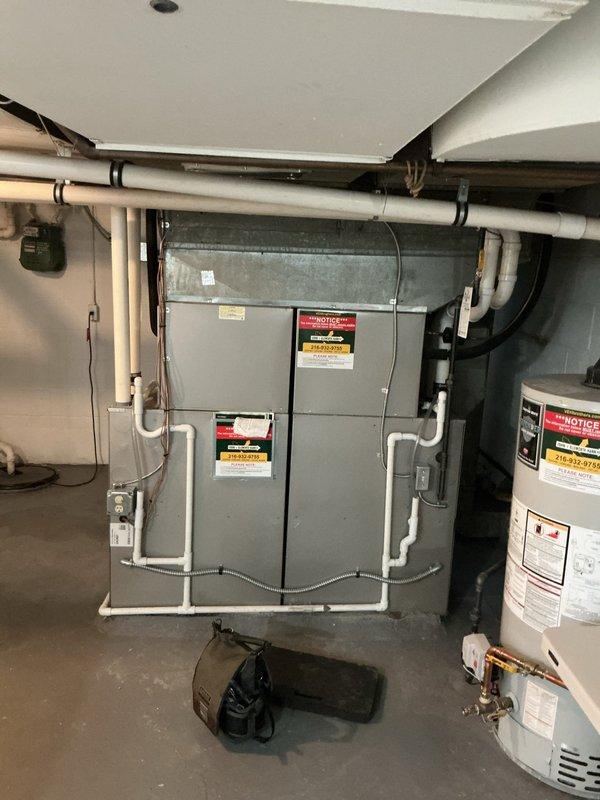 Completed routine air conditioning tune-up on residential HVAC system. Performed comprehensive inspection of furnace/air handler unit and associated components, verified thermostat operation showing proper temperature control at 69°F setpoint, and confirmed system is operating within normal parameters with no deficiencies noted.