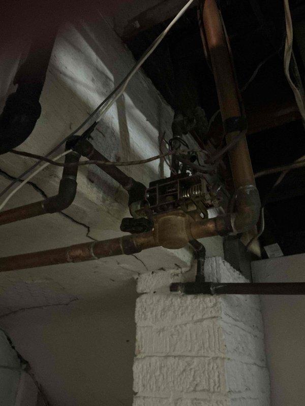 Conducted on-site estimate for replacement of aging water boiler system, over 30 years old and nearing end of serviceable life. Documented existing installation including copper piping configuration, brass valve assemblies, circulator pump, and wall-mounted control unit. Awaiting confirmation to proceed with system replacement.