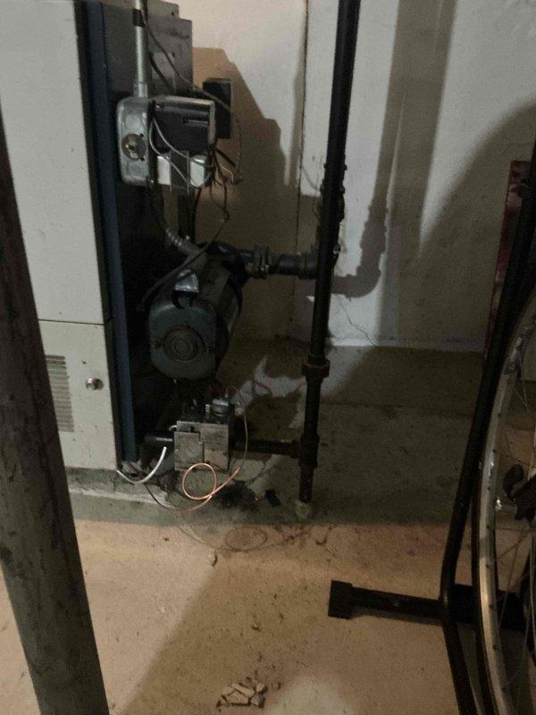 Conducted on-site estimate for replacement of aging water boiler system, over 30 years old and nearing end of serviceable life. Documented existing installation including copper piping configuration, brass valve assemblies, circulator pump, and wall-mounted control unit. Awaiting confirmation to proceed with system replacement.