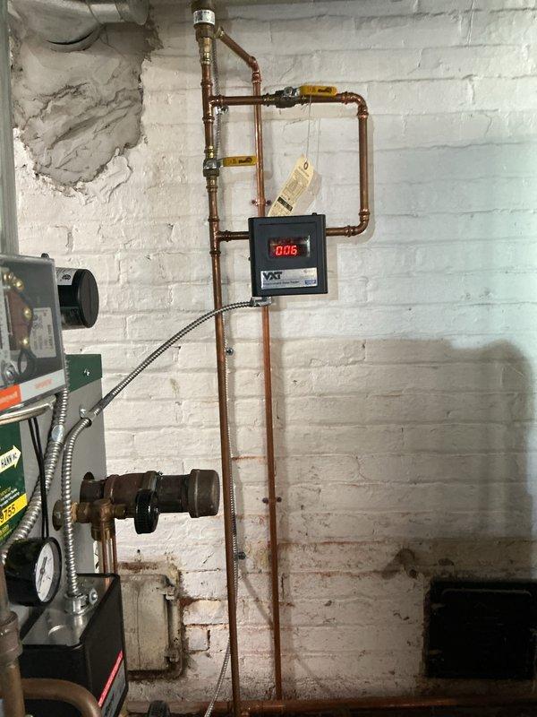 Performed comprehensive annual tune-up and safety inspection on residential boiler system. Conducted thorough examination of all mechanical components, including burner assembly, heat exchanger, copper piping connections, and zone valves with yellow handles. Verified proper operation of digital control module displaying normal pressure readings. Inspected flue piping, condensate drain system, and all safety controls for proper function. Cleaned and tested ignition system, checked gas pressure and combustion efficiency, and verified proper venting. All components found operating within manufacturer specifications with no immediate concerns noted. System running efficiently and safely for continued heating season operation.
