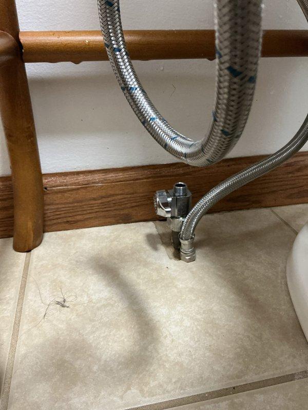 Responded to reported shower leak in 34-year-old residential property. Upon inspection, accessed plumbing connections beneath fixture and examined water supply lines, including braided stainless steel flex hoses, copper supply piping, and shut-off valve assemblies. Inspected all visible connections, fittings, and valve mechanisms for signs of moisture, corrosion, or active leaking. Verified integrity of flexible supply lines and checked proper seating of all plumbing connections in the bathroom area.