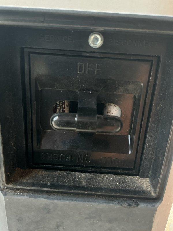 Responded to service call for AC unit not cooling and displaying error message. Upon arrival, found electrical disconnect switch in OFF position at outdoor condenser unit. Restored power to system by switching disconnect to ON position, which cleared the service error message and restored normal cooling operation to the residence.