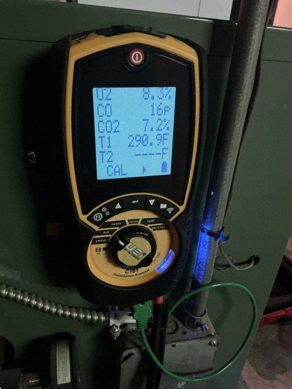 Completed comprehensive boiler tune-up including combustion analysis, which confirmed proper operation with oxygen levels at 6.7%, carbon monoxide at 0.16 ppm, CO2 at 7.2%, and stack temperature at 290.9°F. Replaced batteries in Emerson thermostat and adjusted mounting to allow easier future battery access by homeowner. Verified expansion tank pressure at 17 PSI and documented system parameters for service records.