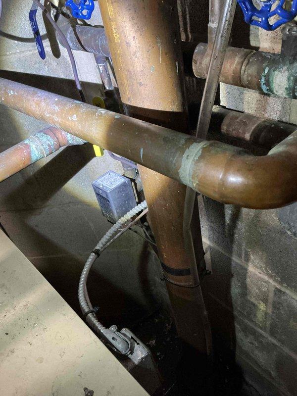 Performed estimate for replacement of 25-year-old residential water boiler system. Assessed existing copper piping network, control components, and current boiler configuration showing significant age-related wear including oxidation and mineral deposits. Customer requesting Weil-McClain replacement unit with installation scheduled for follow-up confirmation.