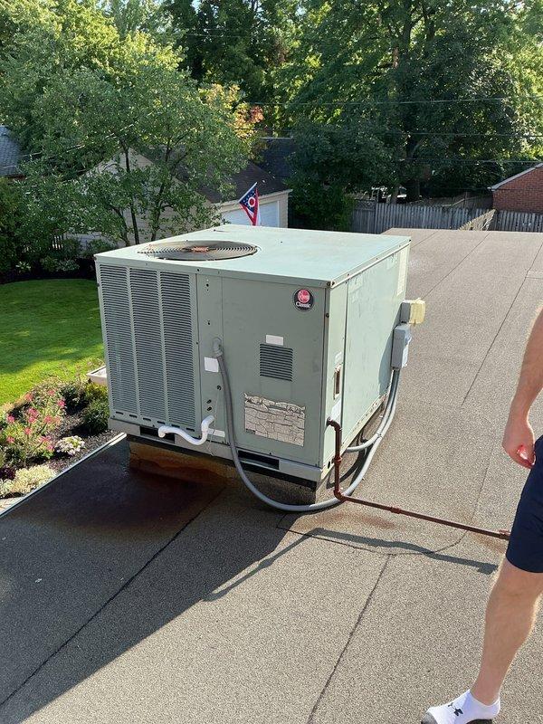 Conducted comprehensive assessment of rooftop package HVAC unit for replacement estimate. Unit located on flat residential roof with easy access, positioned outside window with adequate clearance for equipment removal and installation. Documented existing system configuration including refrigerant line routing, electrical conduit connections, and current mounting platform setup. Photographed unit specifications, manufacturer labels, and surrounding rooftop conditions to determine proper replacement equipment sizing and installation requirements. Evaluated roof membrane integrity around unit base and confirmed structural support adequacy for new equipment installation.