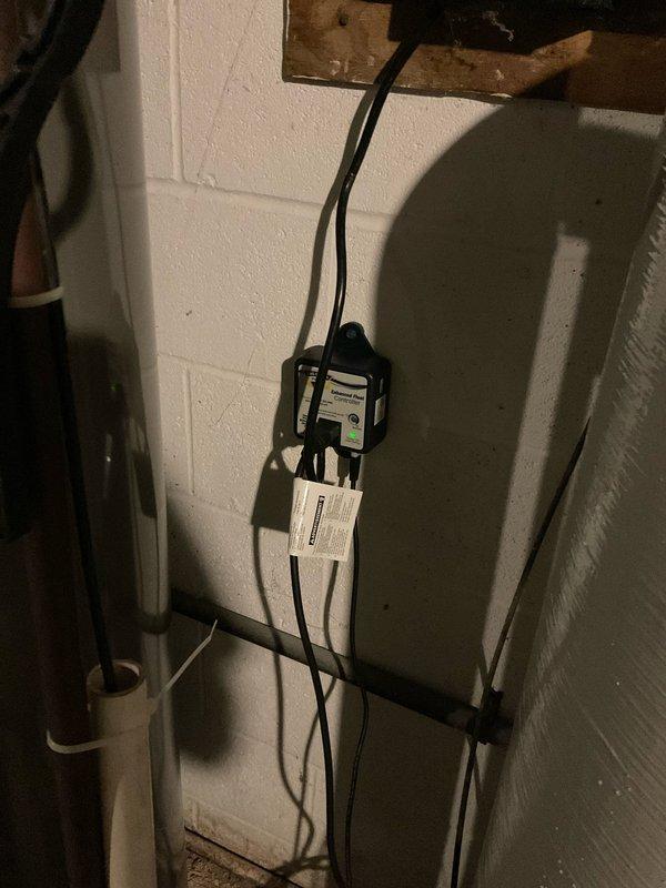 Installed new well pressure tank and associated plumbing connections in basement utility area. Replaced electronic pressure control system with wall-mounted sensor unit, routing electrical cables to ceiling joists for proper connection. Completed all necessary pipe fittings and verified system operation for residential water supply.
