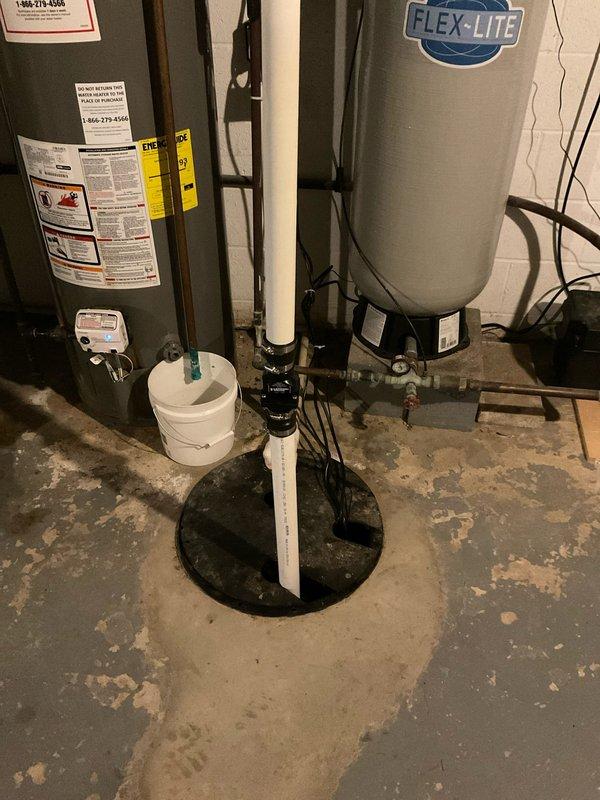 Installed new well pressure tank and associated plumbing connections in basement utility area. Replaced electronic pressure control system with wall-mounted sensor unit, routing electrical cables to ceiling joists for proper connection. Completed all necessary pipe fittings and verified system operation for residential water supply.