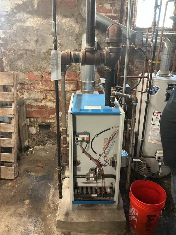 Completed annual tune-up and maintenance on 5-year-old basement boiler system per member service agreement. Performed comprehensive inspection of boiler components, verified combustion efficiency readings using calibrated digital analyzer showing operational temperature at 72°F, checked all electrical connections and internal mechanical components with access panel open, and inspected associated piping infrastructure including black steel supply lines and copper distribution piping. All systems tested and found operating within manufacturer specifications.