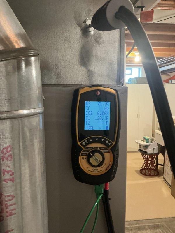 Completed annual furnace maintenance and tune-up on a 5-year-old heating system located in basement. Performed comprehensive system inspection with no issues reported by homeowner. Conducted combustion analysis testing using digital analyzer, measuring CO levels, CO2 percentages, and temperature differentials across the system. All readings confirmed normal operating parameters. System operating efficiently with proper airflow through ductwork. Unit maintained preventatively as part of ongoing membership maintenance program, valid through 2026.
