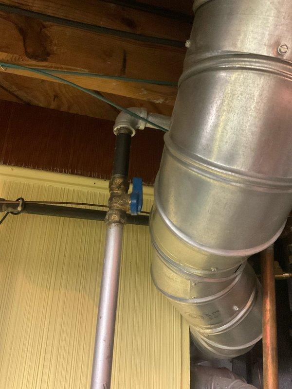 Conducted on-site assessment of existing Reliance brand tanked water heater for replacement estimate. Inspected current installation including copper supply piping, brass shutoff valves, metal vent ducting, and associated plumbing connections. Evaluated utility space configuration, existing infrastructure, and clearance requirements for new unit installation. Documented current water heater specifications, venting system, and connection points. Photographed existing equipment and surrounding mechanical systems to determine replacement requirements and material needs for future installation.