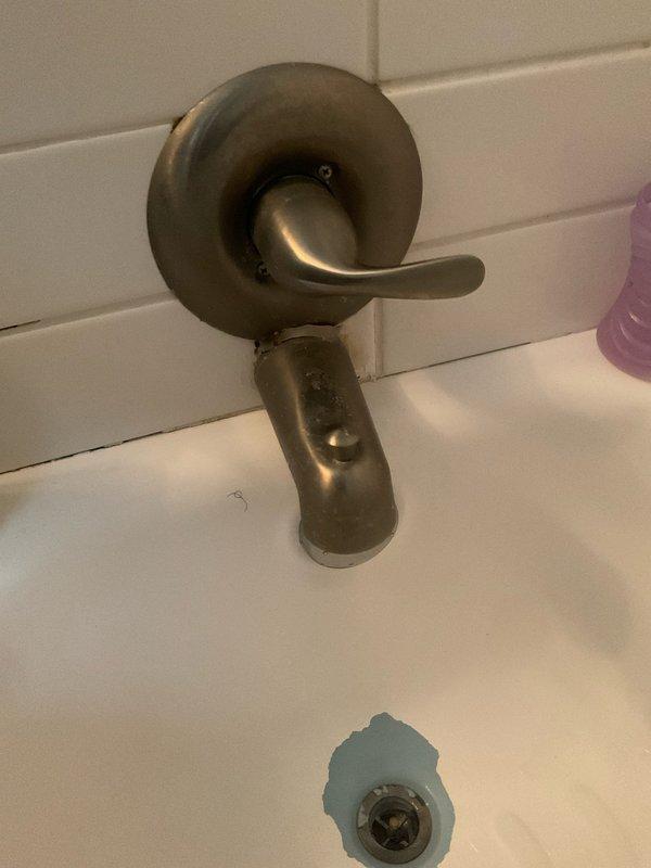 Responded to low/no water pressure complaint and performed comprehensive plumbing assessment. Repaired garbage disposal to restore proper function and verified dishwasher connection integrity. Addressed bathroom sink water pressure issue and completed installation of new bathroom fixtures, including Delta shower valve assembly and tub spout fixture mounted on tiled surfaces. All fixtures tested and confirmed operational upon completion.
