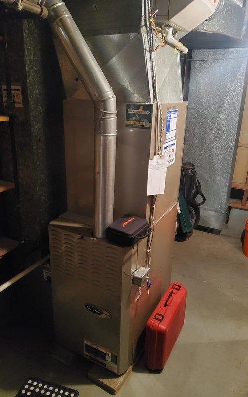 Completed seasonal maintenance on 15-year-old Carrier furnace operating normally. Performed comprehensive tune-up including inspection of heat exchanger, burner assembly, and blower components, verified proper gas pressure and combustion efficiency, cleaned flame sensor, checked and adjusted airflow, tested all safety controls and limit switches, inspected venting system and ductwork connections, and confirmed system cycling properly with no operational concerns noted.