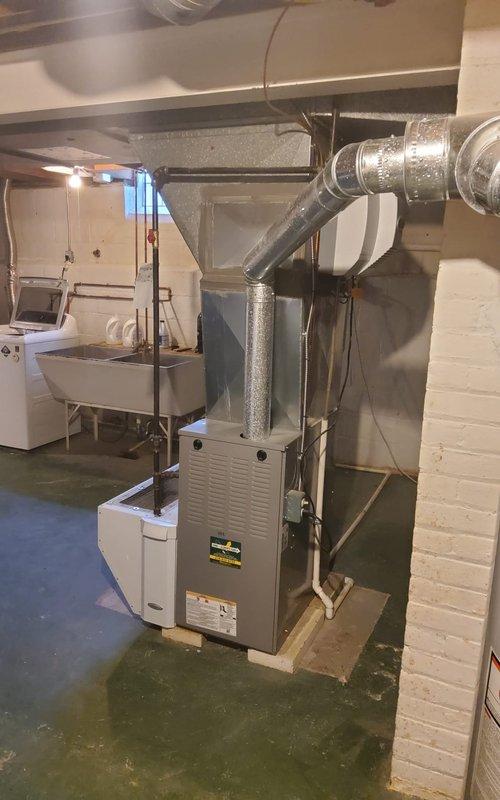 Completed scheduled maintenance on an 8-year-old residential cooling system. Performed comprehensive inspection of indoor furnace unit located in basement and outdoor cylindrical condenser unit with horizontal louver design. Verified proper operation of all components, checked refrigerant levels, inspected electrical connections and disconnect box, examined ductwork connections and insulation integrity, and ensured system is operating efficiently for the cooling season.
