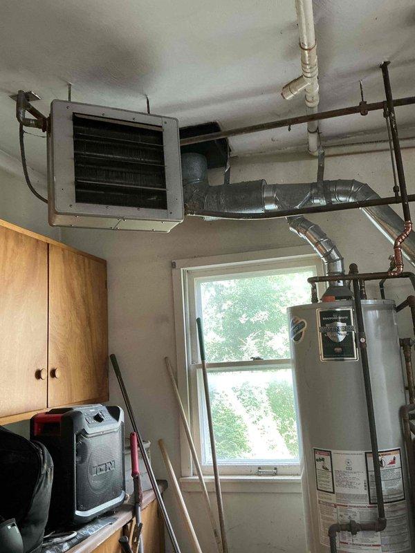 Conducted estimate for non-functioning boiler system in garage mechanical room. Evaluated existing equipment including aging teal-colored boiler unit, cylindrical water heater, and associated piping infrastructure. Provided customer with two options: combination boiler system and standard boiler replacement to restore heating functionality.