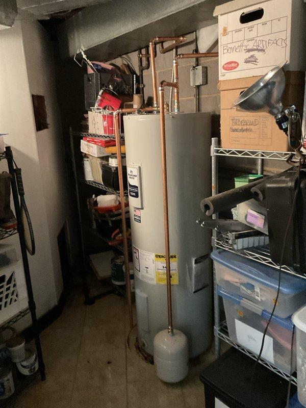 Replaced a failed 50-gallon electric water heater that was leaking from both the top and bottom heating elements. Installed new unit with proper copper piping connections, expansion tank, and pressure relief valve, restoring full hot water service to the residence.