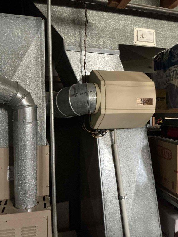 Responded to service call for air conditioning system blowing warm air and not cooling entire residence. Upon inspection, evaluated 15-year-old outdoor condensing unit showing visible signs of age, corrosion on fan guard, and weathering on exterior surfaces. Assessed indoor air handler unit located in basement with connected ductwork and determined system had reached end of serviceable life. Provided comprehensive replacement estimate for complete HVAC system due to age and condition of existing equipment.