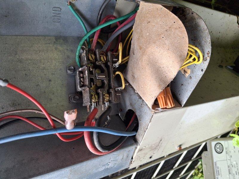 Responded to no cooling call where air conditioning system was completely inoperative. Upon arrival, inspected outdoor condensing unit and found unit not receiving power. Traced electrical supply to disconnect box mounted on fence and discovered failed wire connections with burnt wire nuts indicating previous overheating and electrical failure. Removed damaged connections, stripped wire ends back to clean copper, and installed new wire nuts with proper torque to ensure solid electrical contact. Verified proper voltage at disconnect and restored power to condensing unit. Tested system operation and confirmed compressor and condenser fan motor energized properly with normal amperage draw on all components. System cooling normally upon departure.