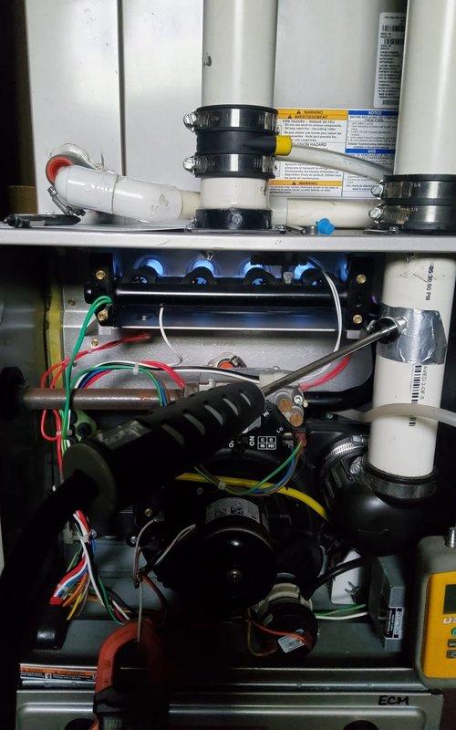 Completed comprehensive tune-up and inspection on 8-year-old furnace system with no reported issues. Performed full system diagnostics, inspected heat exchanger, burner assembly, and flame sensor, verified proper operation of blower motor and capacitor, checked all electrical connections and control board functionality, tested condensate pump and drainage system, inspected and confirmed proper venting through PVC exhaust piping, measured temperature rise and combustion efficiency within manufacturer specifications, and documented equipment condition with photos. All components operating normally with no safety concerns identified.