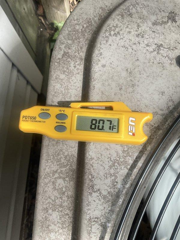 Performed routine air conditioner maintenance on a five-year-old system that was operating properly with no reported issues. Conducted comprehensive tune-up procedures including temperature differential measurements across the evaporator coil, recording supply air temperature of 46.93°F and return air temperature of 80.7°F, indicating proper system performance and adequate cooling capacity. System inspection confirmed all components functioning within normal operating parameters.