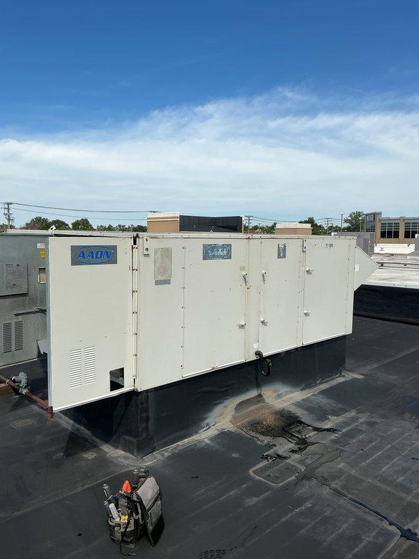 Responded to service call for non-operational rooftop HVAC unit. Upon arrival, located AAON commercial air conditioning system on flat membrane roof and performed diagnostic assessment to identify cause of failure. Documented equipment condition and accessed interior mechanical spaces to complete troubleshooting and service work necessary to restore cooling operation.