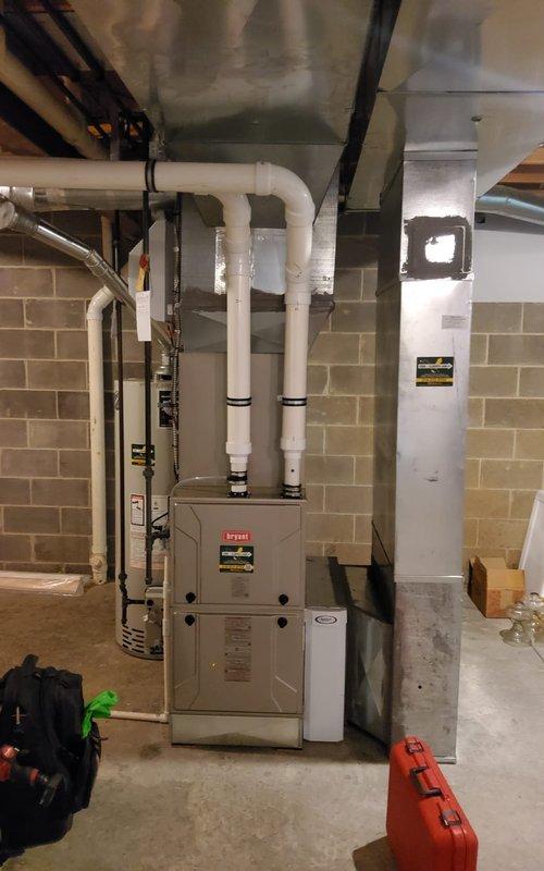 Completed comprehensive fall furnace inspection and tune-up on a 2-year-old Bryant heating system. Performed full system diagnostic, verified proper burner operation with clean blue flame combustion, inspected all electrical connections and wiring, tested blower motor assembly, and confirmed proper venting through PVC intake and exhaust pipes. All components operating within manufacturer specifications with no deficiencies noted.
