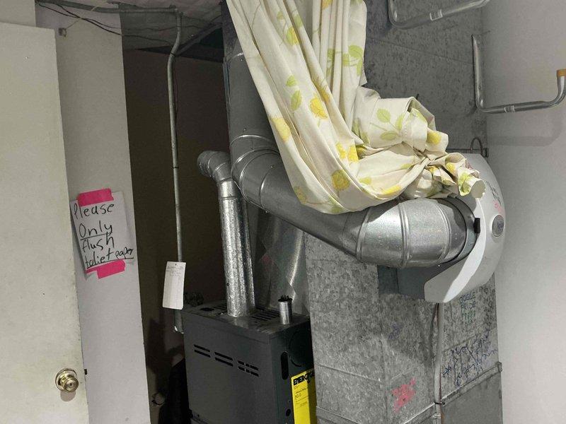 Assessed 25-year-old commercial air conditioning system with failed condenser fan motor located in exterior service alley. Unit showed extensive age-related deterioration, surface contamination, and complete fan assembly failure rendering system inoperable. Provided comprehensive replacement estimate for new commercial HVAC system scheduled for installation, including removal of existing equipment, proper disposal, and installation of appropriately-sized replacement unit to restore cooling capacity to facility.