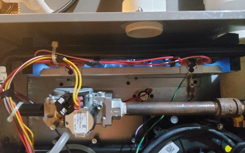 Completed routine pre-winter tune-up on 8-year-old furnace located in basement. Performed comprehensive system inspection including combustion analysis which revealed CO levels at 16 ppm and CO2 at 8.8%, with supply temperature reading 120.3°F and temperature rise at 49.4°F. Verified proper operation of gas valve assembly, inspected all electrical connections and wiring throughout unit, and confirmed blower motor functionality. All components found operating within manufacturer specifications and system ready for heating season.