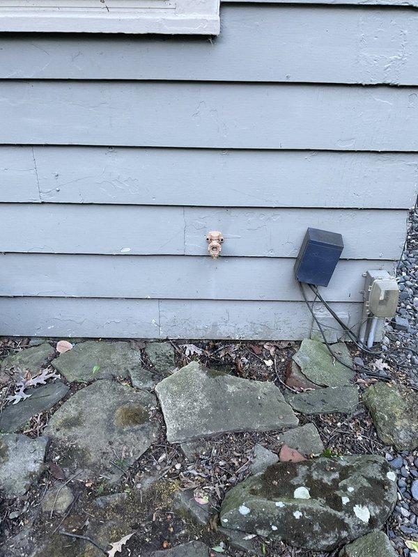 Installed new exterior hose bib with half-inch valve by accessing cold water supply line through basement wall opening. Relocated existing plumbing in basement ceiling to accommodate new installation, ran copper supply line, and mounted outdoor spigot on exterior siding. Wall opening and drywall repair remained customer responsibility per agreement.