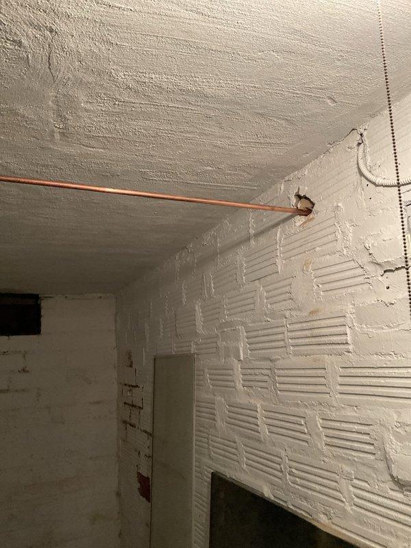 Installed new exterior hose bib with half-inch valve by accessing cold water supply line through basement wall opening. Relocated existing plumbing in basement ceiling to accommodate new installation, ran copper supply line, and mounted outdoor spigot on exterior siding. Wall opening and drywall repair remained customer responsibility per agreement.