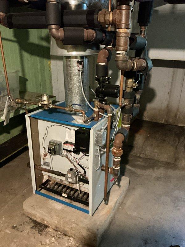 Performed comprehensive annual maintenance and tune-up on 20-year-old hydronic heating system. Inspected boiler unit, expansion tank, circulator pump, zone valves, and all associated piping and connections. Verified proper operation of all mechanical components, tested safety controls, and confirmed system pressurization within manufacturer specifications.
