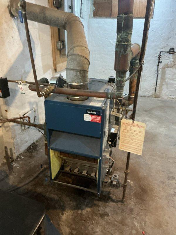 Returned to property to perform comprehensive boiler maintenance following customer concerns that initial service was incomplete. Conducted thorough cleaning of heat exchanger, burner assembly, and combustion chamber, removing accumulated debris and buildup that was visible during inspection. Verified proper combustion, tested all safety controls, and documented system operation with photographic evidence showing the boiler unit and internal components to confirm complete maintenance procedures were executed per manufacturer specifications.