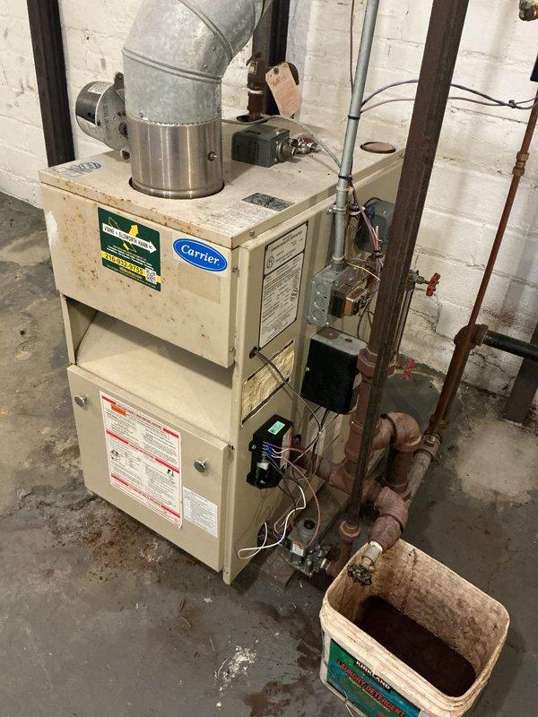 Completed annual heating maintenance and tune-up on 15-year-old Carrier boiler system. Performed comprehensive inspection of unit including burner assembly, heat exchanger, venting system, and all safety controls. Checked and tested electrical connections, control module operation, and thermostat communication. Inspected copper piping, plumbing connections, and associated cast iron supply/return lines showing age-appropriate surface oxidation. Verified proper combustion, gas pressure, and system cycling. All components found operating within manufacturer specifications with no immediate safety concerns identified.