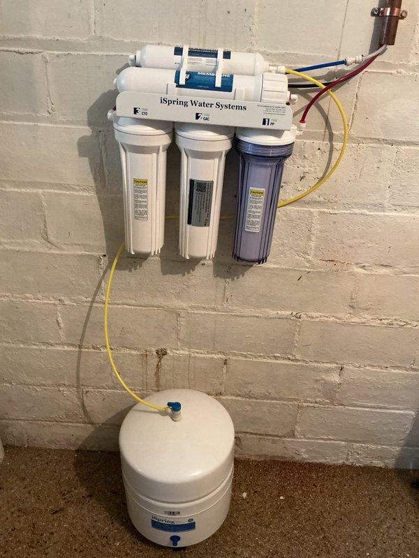 Installed iSpring reverse osmosis water filtration system on basement block wall, including three-stage filter housings, pressurized storage tank, and all necessary supply lines and connections. Additionally, installed a comfort height elongated toilet with seat and angle stop valve on the second floor. First year of replacement filters provided with the system installation.