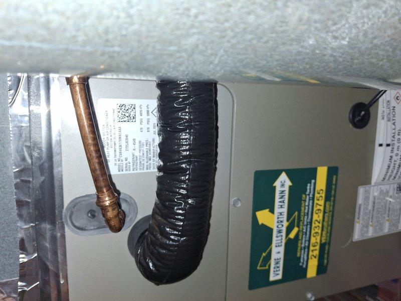 # HVAC Maintenance - Cooling System Service

Completed comprehensive cooling system tune-up and maintenance on residential heat pump air conditioning unit and furnace system. Performed thorough inspection of air handler unit, examining finned heat exchanger coils for proper condition and airflow efficiency. Inspected copper refrigerant lines and associated insulation wrapping at connection points, verifying integrity of black protective insulation material. Conducted visual assessment of equipment housing, labels, and operational components to ensure system readiness. All components found to be in satisfactory operating condition with heat exchanger fins showing no visible damage or deterioration.