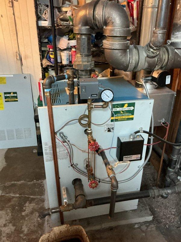 Completed scheduled maintenance on a Weil-McLain Galaxy GXHA-160 EDI steam boiler, manufactured January 2021, operating on natural gas with 160,000 BTU/HR input capacity. Performed comprehensive tune-up including inspection of all operating controls, pressure gauge verification, safety valve testing, and examination of copper piping connections and electrical components. Unit was found operating properly with no deficiencies noted; all components functioning within manufacturer specifications at time of service.