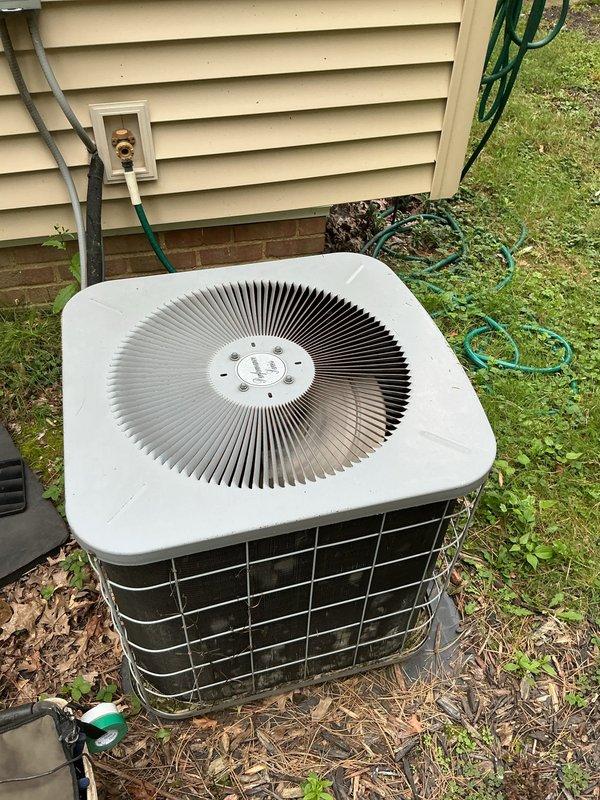 Responded to follow-up service call for non-operational air conditioning system after previous utility power issue. Upon arrival, discovered severely corroded electrical disconnect box with extensive rust damage and deterioration to mounting components and wiring connections. Found substantial debris accumulation including nest material and organic matter around electrical components, creating potential safety hazard and contributing to equipment failure. Replaced damaged disconnect box and corroded electrical components, cleaned all debris from area, verified proper voltage supply at 240V, and restored power to outdoor condensing unit. System tested and confirmed operational with normal amperage draw and proper cooling cycle.