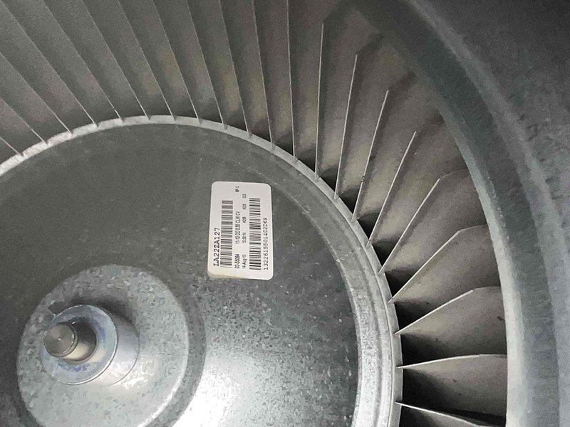 Completed maintenance inspection on 12-year-old residential air conditioning system during scheduled service window. Performed comprehensive evaluation of cooling equipment, including inspection of blower wheel assembly and condenser unit. Blower wheel showed normal operational wear with minor dust accumulation consistent with system age. Verified manufacturer specifications and serial number documentation on air handler unit, confirming R-410A refrigerant type and proper labeling compliance. All major components functioning within normal parameters with no immediate service needs identified at this time.